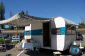 Photo shows a great looking side awning on a beautifully restored Aladdin travel trailer